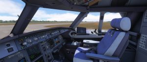 A cockpit view from an Airbus A321 simulation shows the flight deck empty and ready for departure, with the instrument panel, control columns, and forward windows visible against a bright daytime airfield outside.