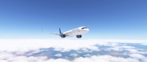An A321 cruises high above a bright cloud layer under a clear blue sky, captured in a clean in-flight simulation view.