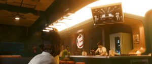 A warm, amber-lit interior frames a quiet *Cyberpunk 2077* conversation scene, with several characters seated around a sleek lounge or meeting area beneath glowing ceiling panels and futuristic wall displays.